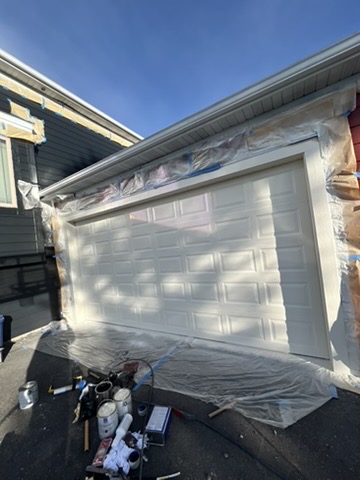 Garage door painting with protective covering