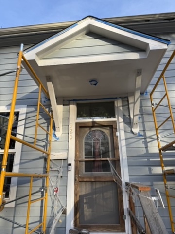 Home entrance painting with scaffolding