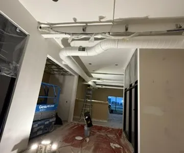 Home entrance painting with scaffolding and safety equipment - Bozeman MT house painters