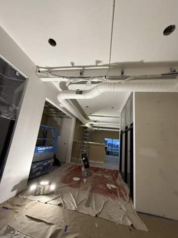 Home entrance painting with scaffolding and safety equipment - Bozeman MT house painters